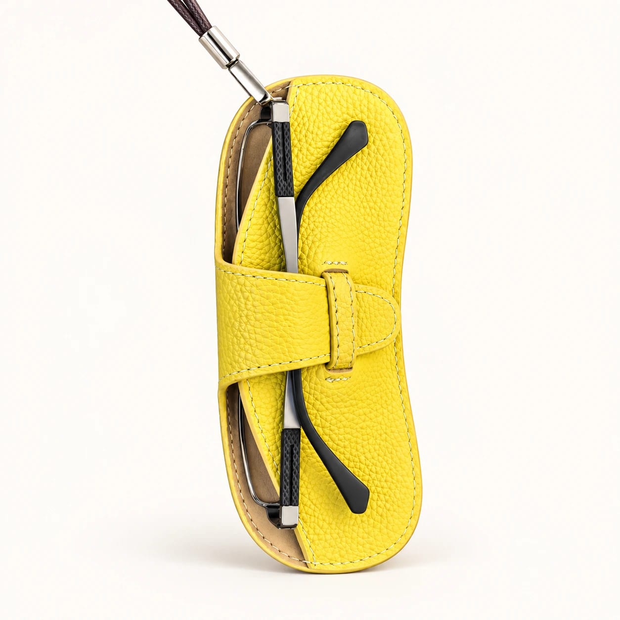 the rightmost yellow eyewear pouch, including its original cord and silver clip