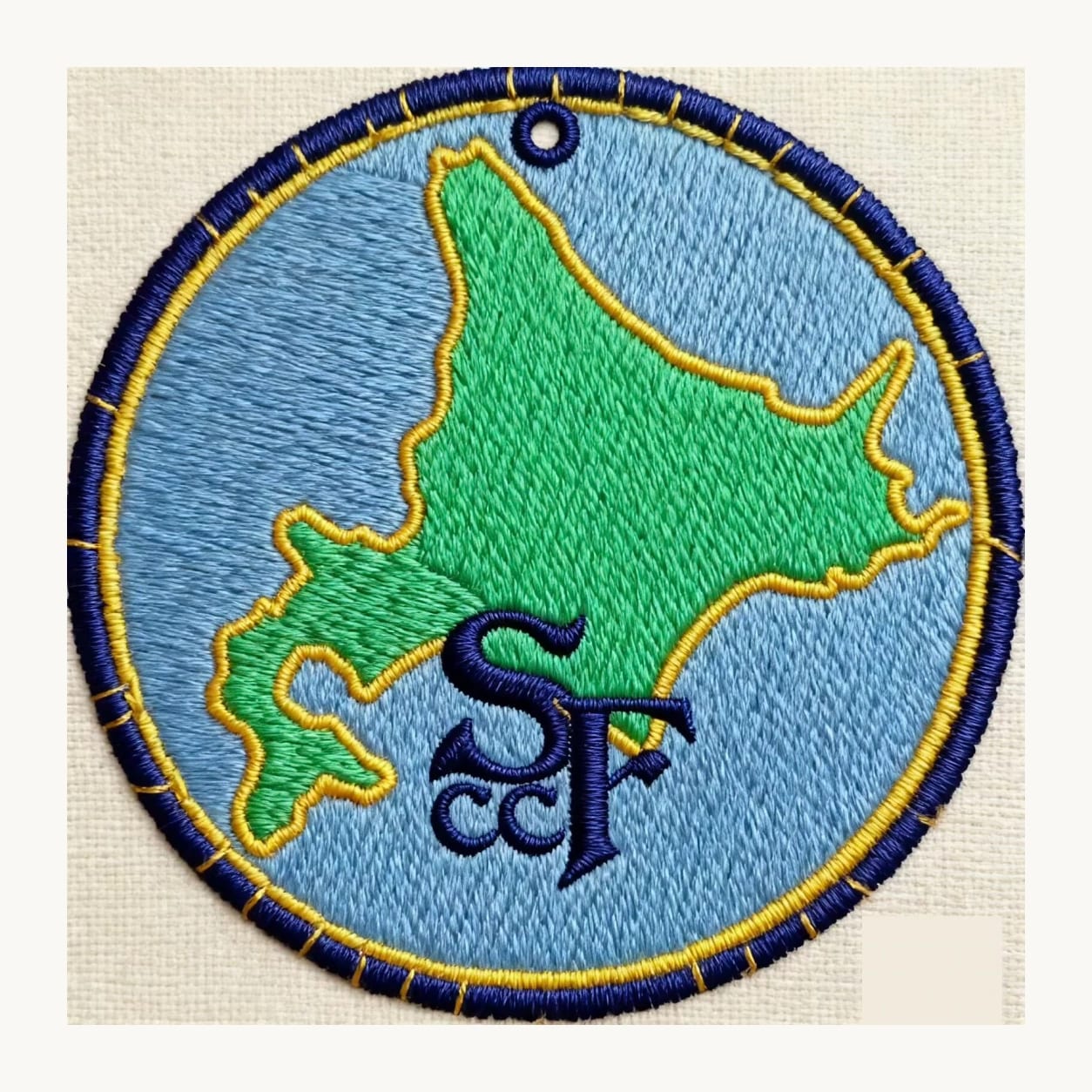 round embroidered map patch